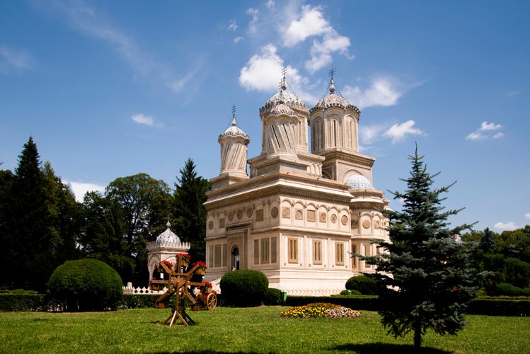 photo of view of The Cathedral of Curtea de Argeș 16th century in Romania.