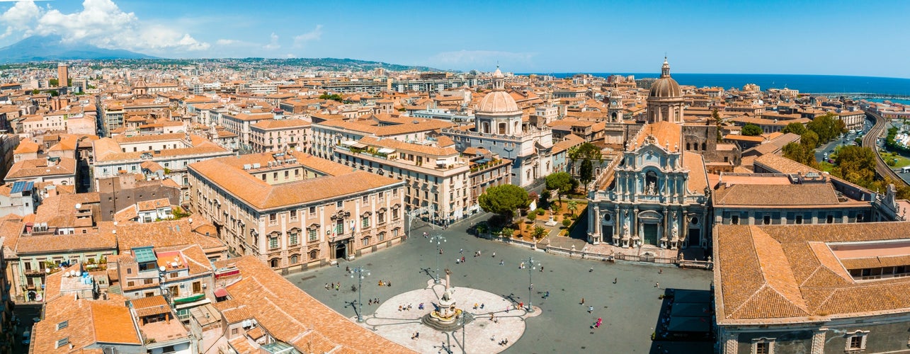 Aerial view on via Etnea in Catania. Dome of Catania and the main street with the background of volcano Etna, Sicily, Italy. Catania the UNESCO World Heritage.