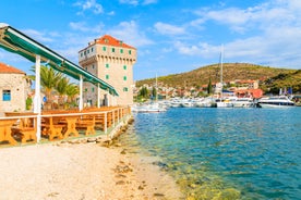 photo of a beautiful panoramic view of Kastel Luksic harbor and landmarks summer view, Split region of Dalmatia, Croatia.