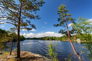 Photo of aerial view of beautiful landscape of lakes and forest in Imatra, Finland.