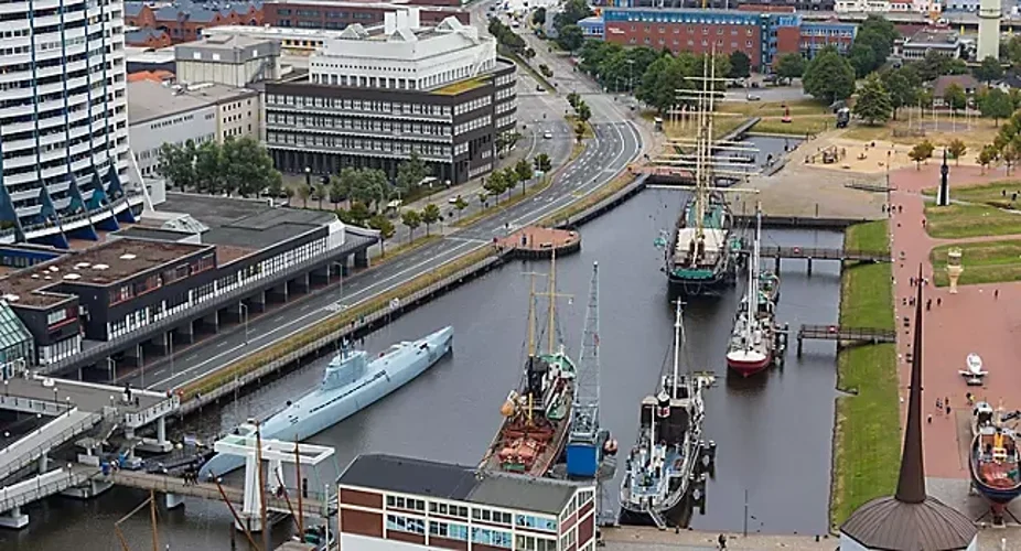 Photo of cityscape seen from  above with a U boat in the harbor of  Bremerhaven, Germany.