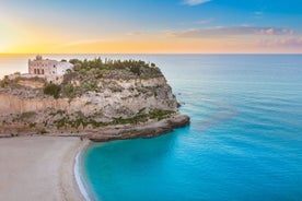 photo of an aerial view of Parghelia in Italy. Overview of seabed seen from above, transparent water and beach with umbrellas.