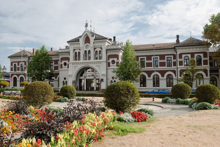 photo of view of  scenic view of Hamar station building and flowers, Hedmark, Norway.