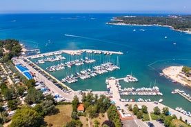 Photo of aerial view to the town of Porec in Istria, Croatia on Adriatic coast.