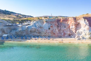 Photo of panoramic aerial view of the popular Platis Gialos beach on the Greek island of Mykonos with turquoise sea, Greece.