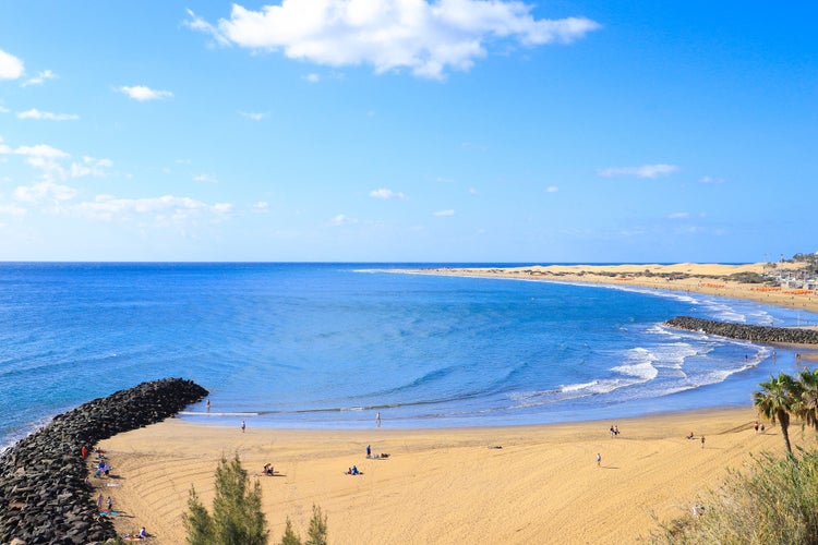 Photo of Playa Del Ingles beach with the dunes in the background, Gran Canaria, Spain.