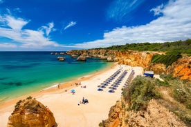 Photo of Carvoeiro fishing village with beautiful beach and colourful houses, Portugal.