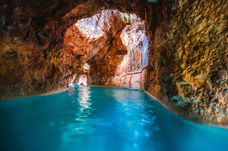 photo of view of Miskolc, Hungary - 3. june. 2022: Tourists enjoy at the cave with thermal water - natural SPA in Hungary at Miskolc Hungary. Rock tube with thermal water