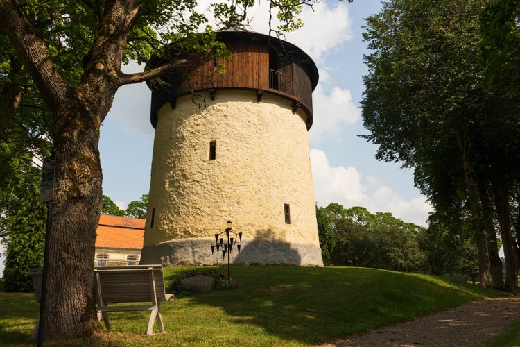 photo of view of Protestant church, bell tower and cemetery in Lerbo, Södermanland, Sweden.