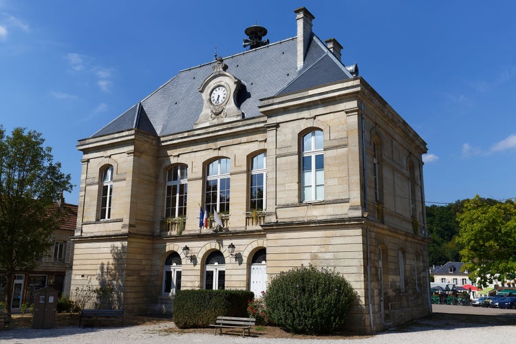 Photo of The Pierrefonds Town Hall with its clock and the warning siren on the roof. Picardy region. France.