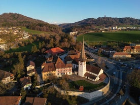 Bern, Switzerland. View of the old city center and Nydeggbrucke bridge over river Aare.