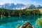 Photo of Carezza lake (Lago di Carezza, Karersee) with Mount Latemar, Bolzano province, South tyrol, Italy.