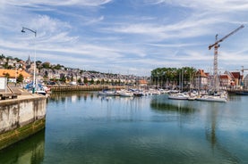 photo of Port of Deauville and city skyline in a sunny summer day, Normandy, France.