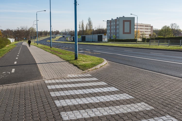 photo of view of Empty street and one pedestrian due to Coronavirus Covid-19 pandemic in Lubin, Poland.