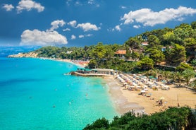 Photo of panoramic aerial view of the popular Platis Gialos beach on the Greek island of Mykonos with turquoise sea, Greece.