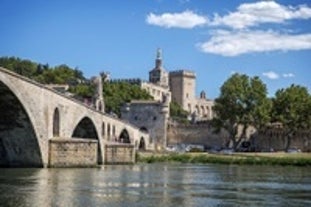 Photo of colorful yellow and orange houses and Eiffel Bridge, Old fish stalls, reflected in water river Onyar, in Girona, Catalonia, Spain.