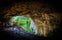 Photo of the entrance of Peak Cavern, also known as the Devil's Arse, in Castleton, Derbyshire, England, UK.