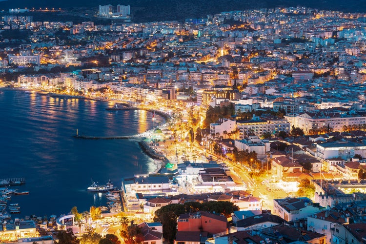 Kusadasi, Aydin Province, Turkey. Waterfront And Kusadasi Cityscape In Summer Evening.