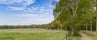 photo of panorama of beautiful morning of a little house at the foot of the Lemelerberg hill in Lemele, Overijssel, Netherlands.