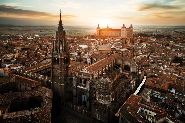 photo  of view of Primate Cathedral of Saint Mary of Toledo aerial view at sunset in Spain