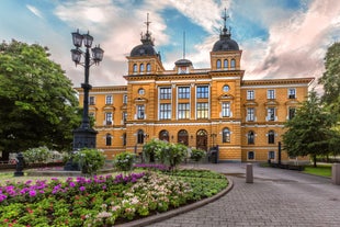 Early autumn morning panorama of the Port of Turku, Finland, with Turku Castle at background.