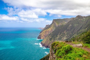 Photo of beach aerial view of Machico bay and Cristiano Ronaldo International airport in Madeira, Portugal.