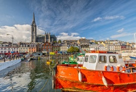  Cork, Ireland. Fishing boats inside the port of Cobh. A city with colorful houses in Ireland.