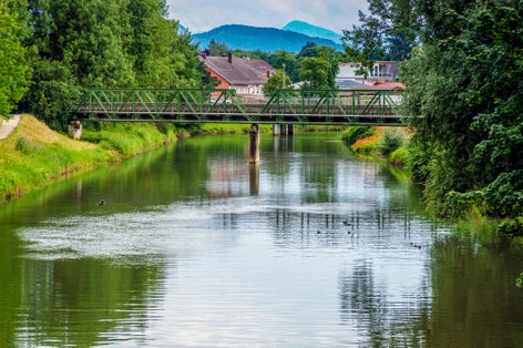 Cityscape of the city of Rosenheim in Bayern in Germany with river Mangfall and Alps mountain in background