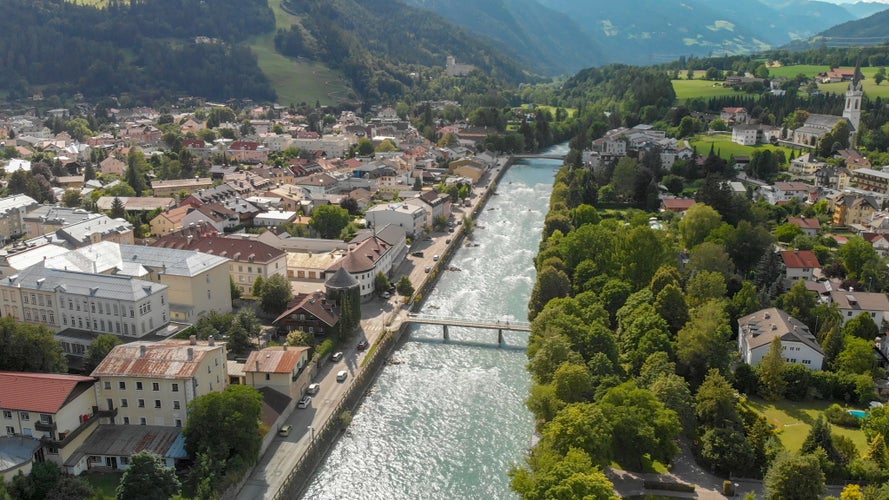 PHOTO OF VIEW OF Aerial view of Lienz cityscape and valley, Austrian alps.