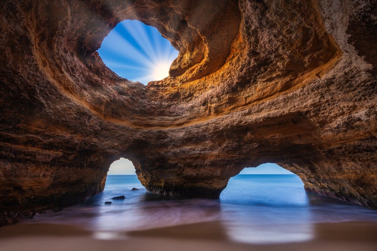 Photo of Scenic view of Benagil Cave with tranquil waters. Lagoa, Portugal.