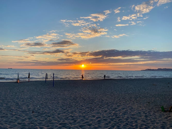 Photo of sun setting on Durrës sandy beach.