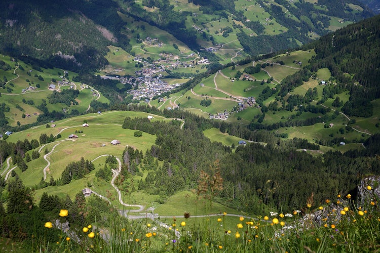 Photo of The valley of Areches, Beaufort, Beaufortain, Savoie, France, surrounded by mountain pastures and mountains, and viewed from a hiking trail on a ridge leading to Roche Parstire.