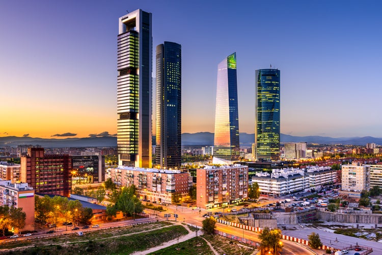 Photo of Madrid, Spain financial district skyline at twilight.