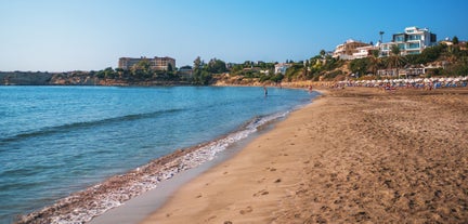 Photo of aerial view on clear blue water of Coral bay in Peyia, Cyprus.