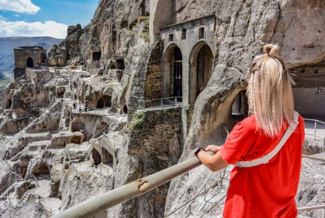 Photo of girl tourist in Vardzia-cave monastery in South Georgia.