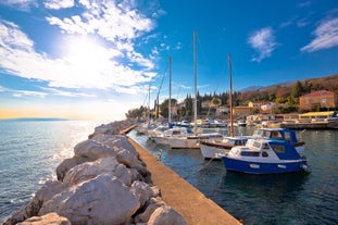 photo of aerial panoramic view of beautiful town of Lovran and sea walkway in Croatia.