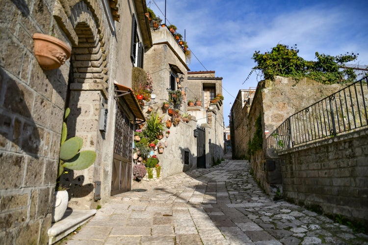 Photo of narrow street among the old stone houses of the oldest district of the city of Caserta, Italy.