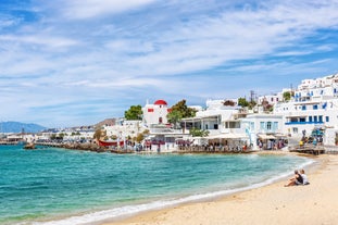 Photo of panoramic aerial view of the popular Platis Gialos beach on the Greek island of Mykonos with turquoise sea, Greece.