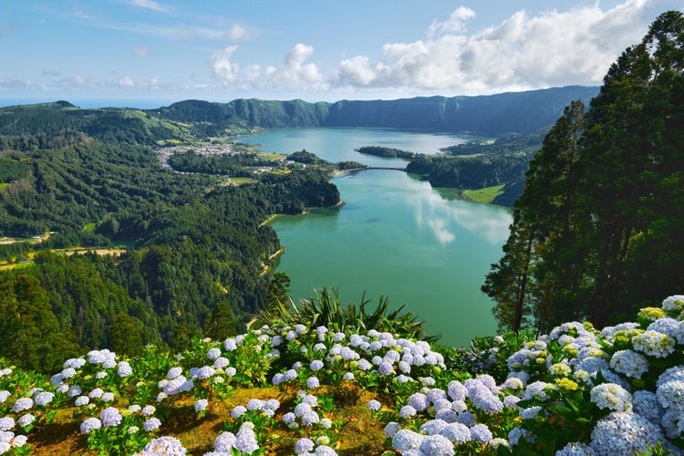 Photo of Picturesque paradise of Sete Cidades in Azores, Sao Miguel. Volcanic craters and stunning lakes at sunny day. Ponta Delgada, Portugal. Natural wonders, landmarks and tourist attractions concept.