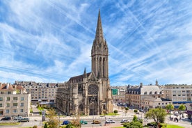 Photo of Vannes, beautiful city in Brittany, boats in the harbor, with typical houses and the cathedral in background, France.