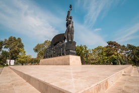 Photo of Water fountain in central square in Iasi town, Cultural Palace in background, Moldavia, Romania.