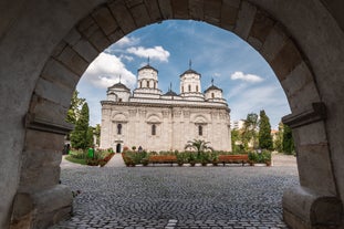 Antique building view in Old Town Bucharest city - capital of Romania and Dambrovita river. Bucharest, Romania, Europe.