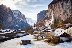 Photo of beautiful autumn view of Lauterbrunnen valley with gorgeous Staubbach waterfall and Swiss Alps at sunset time, Switzerland.