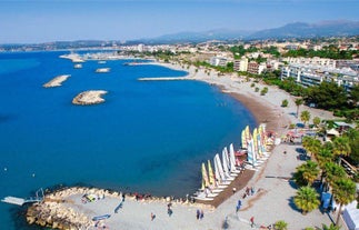 Photo of aerial cityscape view on French riviera with yachts in Cannes city, France.