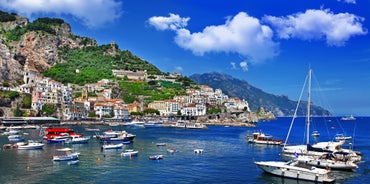 Photo of aerial morning view of Amalfi cityscape on coast line of Mediterranean sea, Italy.