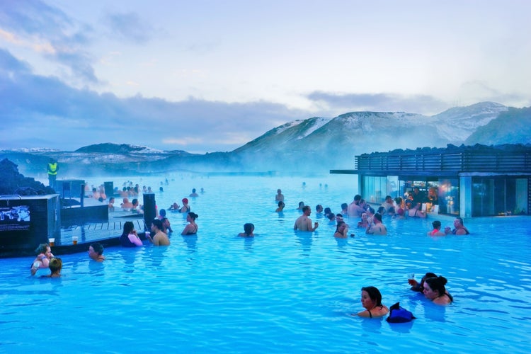 Blue Lagoon pool at dusk with lots of tourists.jpg