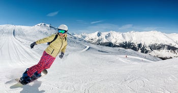 Photo of aerial view of Livigno town covered in snow in winter, Italy.