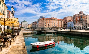 Photo of Trieste lighthouse Phare de la Victoire and cityscape panoramic aerial view, Friuli Venezia Giulia region of Italy.