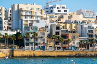 Aerial view of Lady of Mount Carmel church, St.Paul's Cathedral in Valletta embankment city center, Malta.