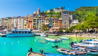 Photo of Riomaggiore with colorful houses along the coastline, one of the five famous coastal village in the Cinque Terre National Park, Liguria, Italy.